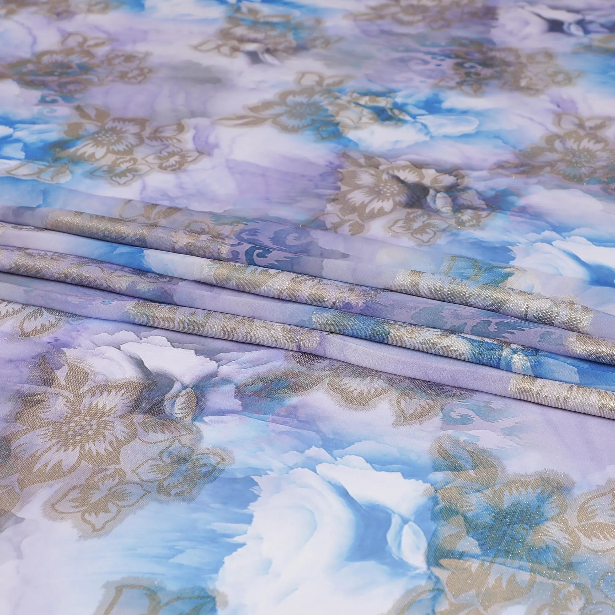 Maya blue synthetic chiffon fabric with same tone and lavender print having gold metallic lurex in floral design-D7004